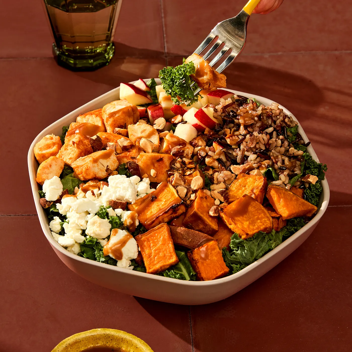 Sweetgreen Autumn Harvest Bowl with wild rice, shredded kale, blackened chicken, roasted sweet potatoes, apples, goat cheese, and toasted almonds