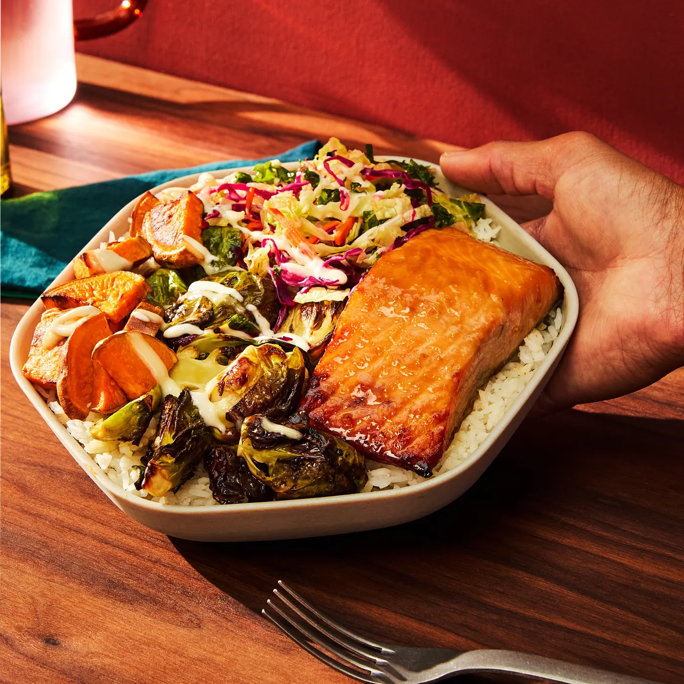 Sweetgreen Maple Glazed Salmon Plate with miso-glazed salmon, maple-glazed brussels, roasted sweet potatoes, napa cabbage slaw, and white rice